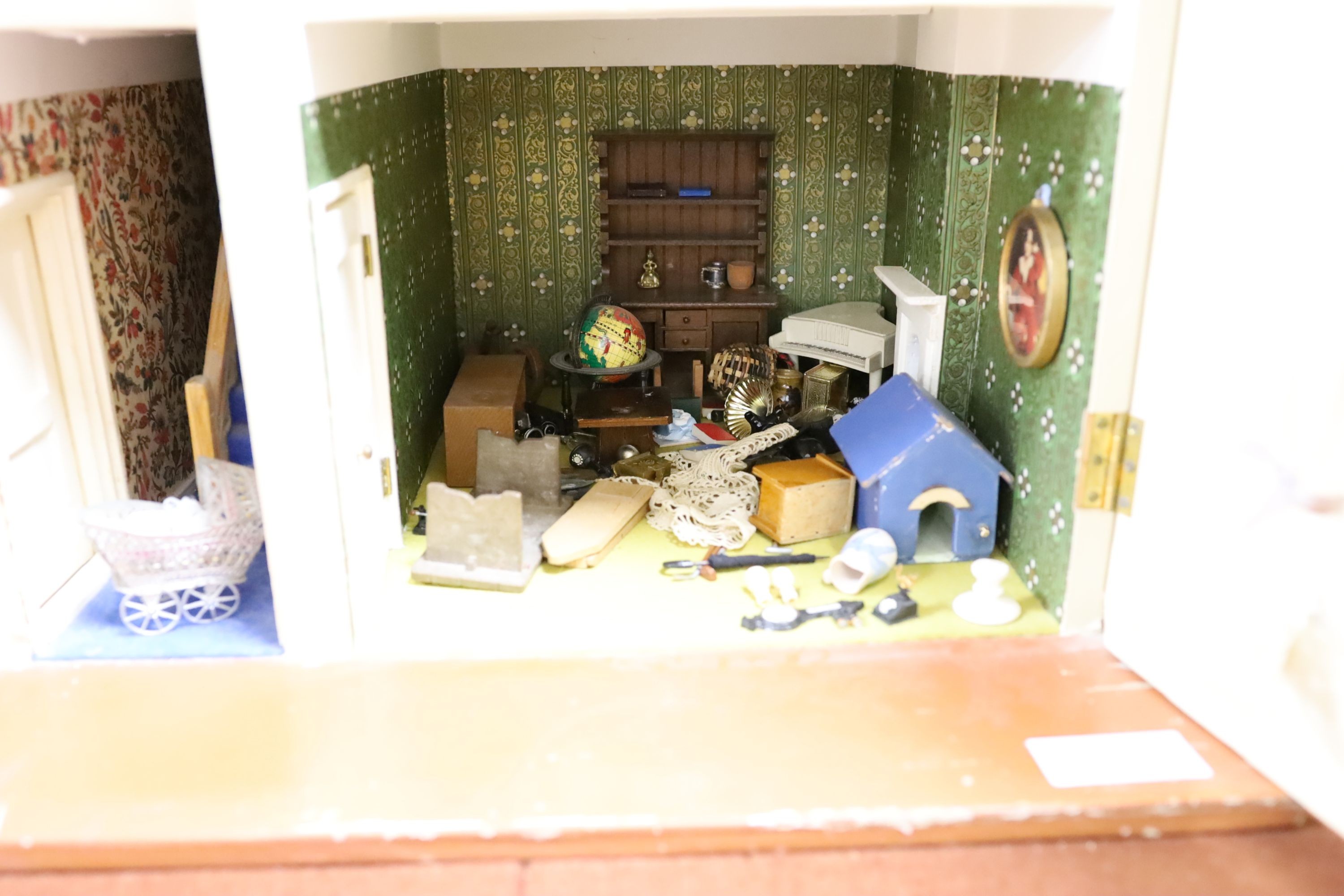 A dolls house, length 74cm, depth 39cm, height 66cm